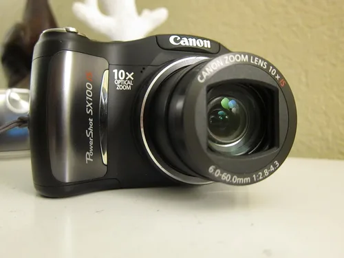 Vista 2 de Canon PowerShot SX100IS Cámara digital de 8MP con zoom estabilizado de imagen óptica 10x (negro)