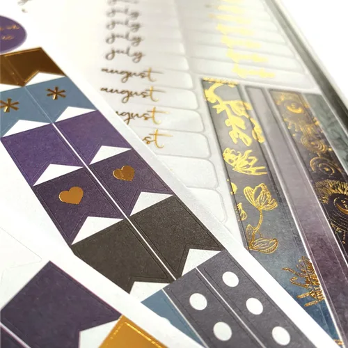 Vista 3 de Paper House Productions Planificador de 12 meses sin fecha de 9.5 pulgadas con calcomanías de bandera de mes y evento, celestial